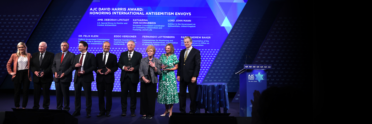 Seven international antisemitism envoys with Holly Huffnagle and David Harris at AJC Global Forum 2023