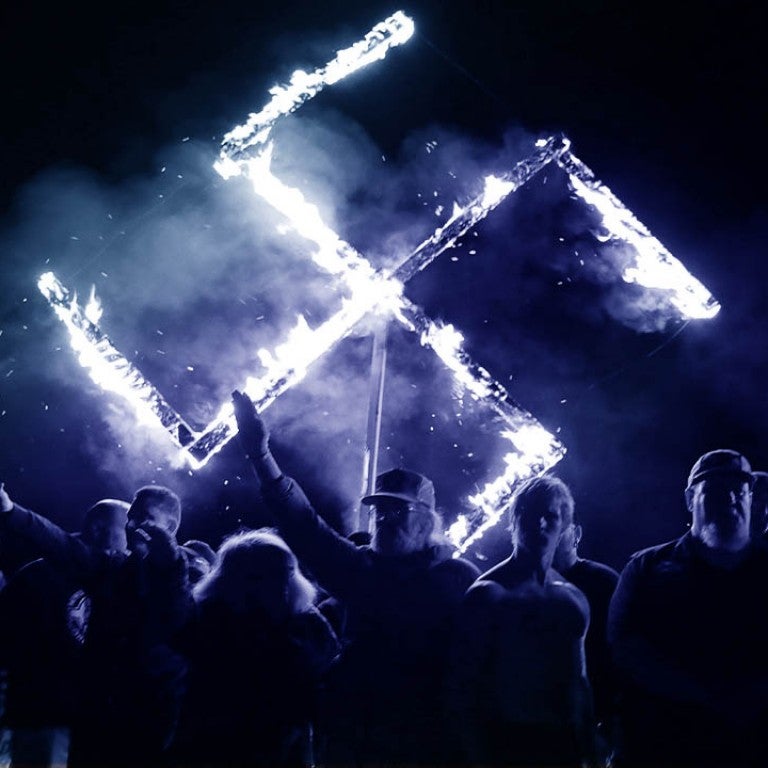 Graphic displaying burning swastika